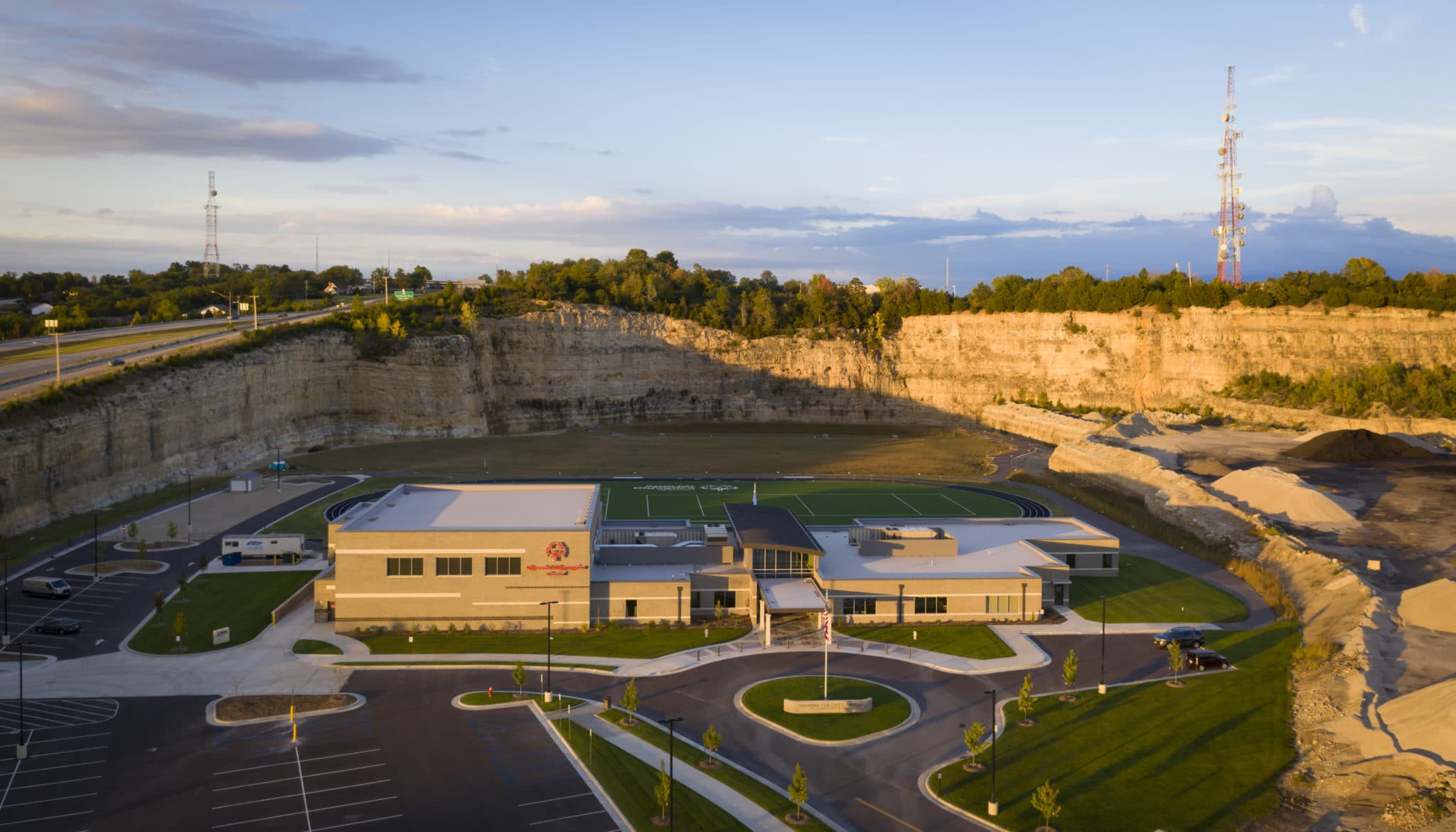 An aerial photo of the front entrance of the Training for Life Campus at sunset