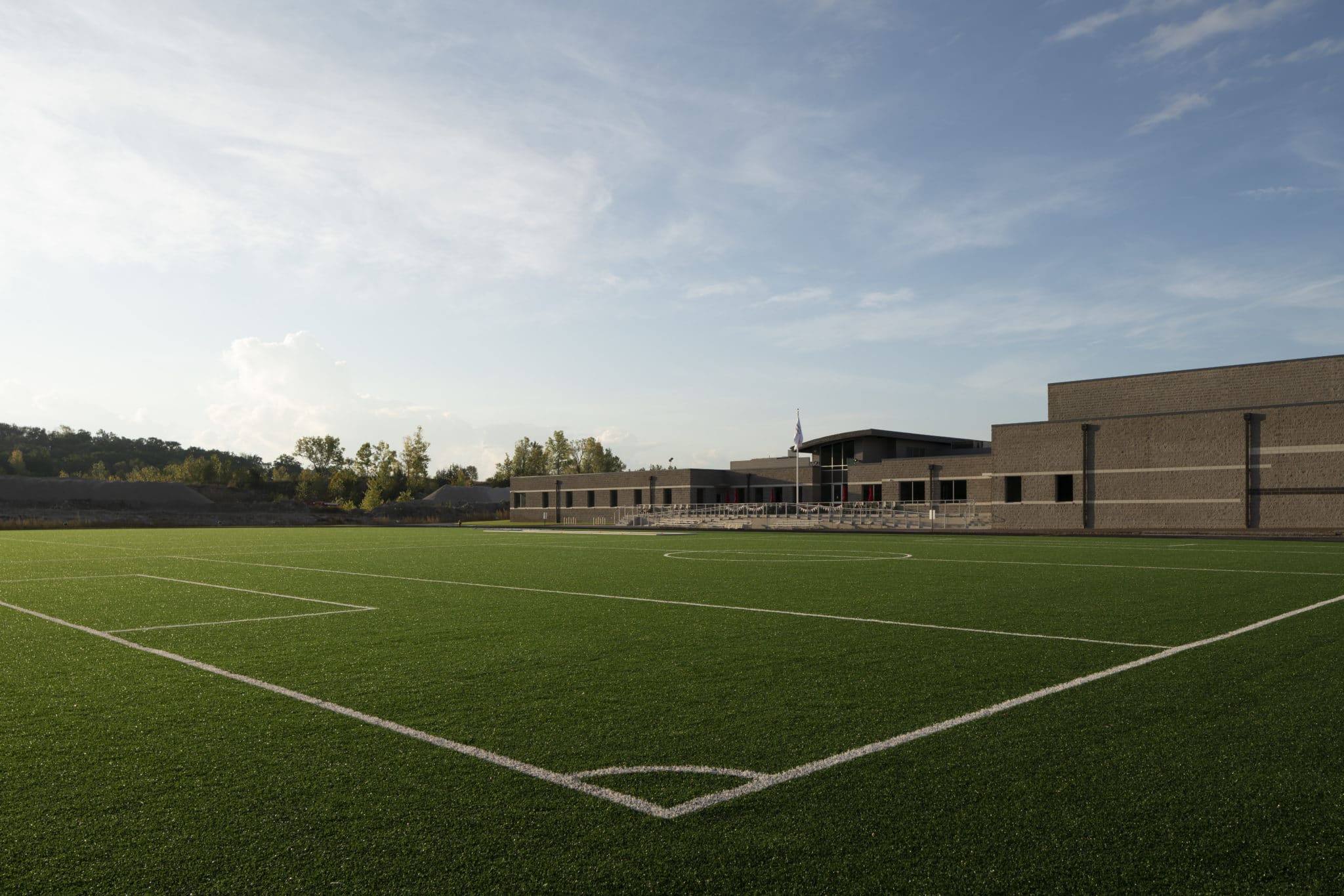 An exterior photo of the turf field at the Training for Life Campus