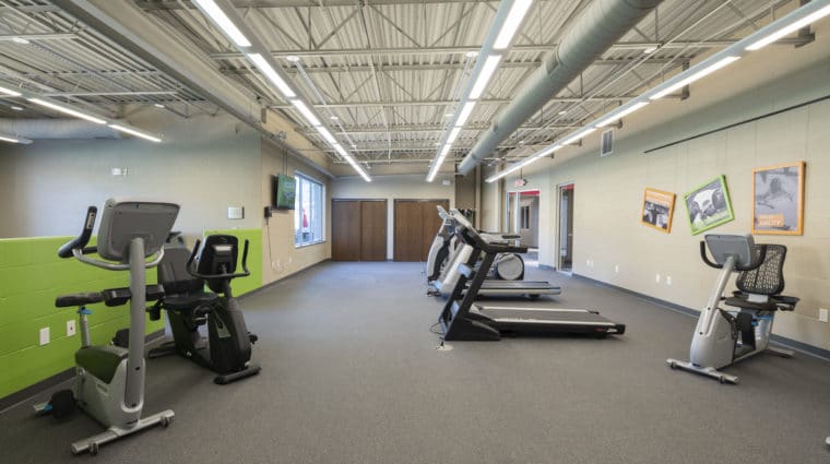 Treadmills and stationary bicycles in the fitness center at the Training for Life Campus