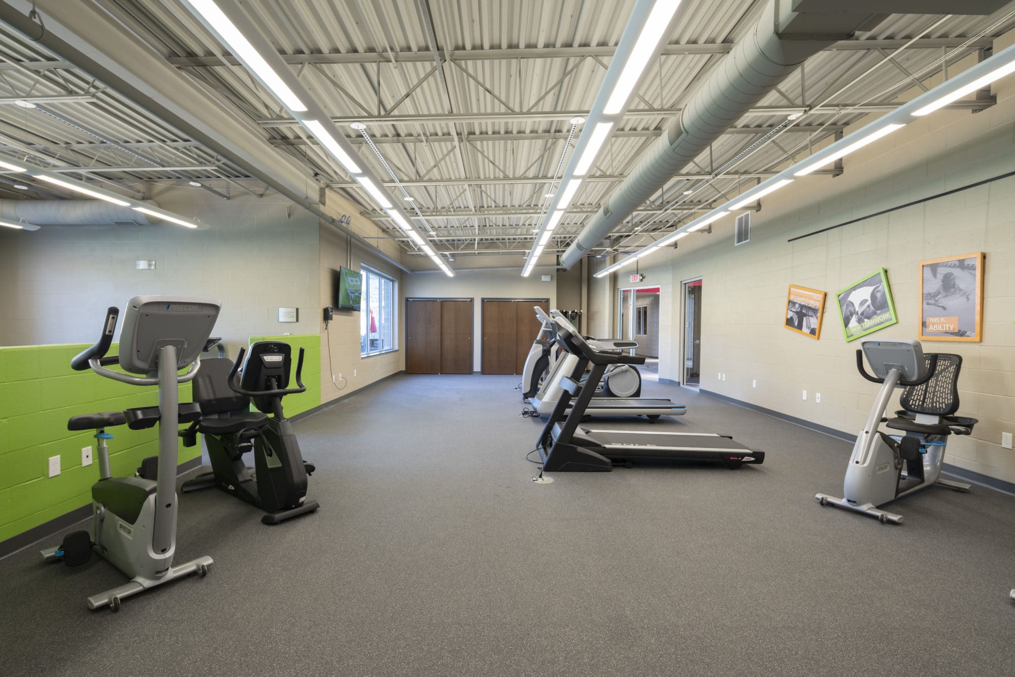 Treadmills and stationary bicycles in the fitness center at the Training for Life Campus
