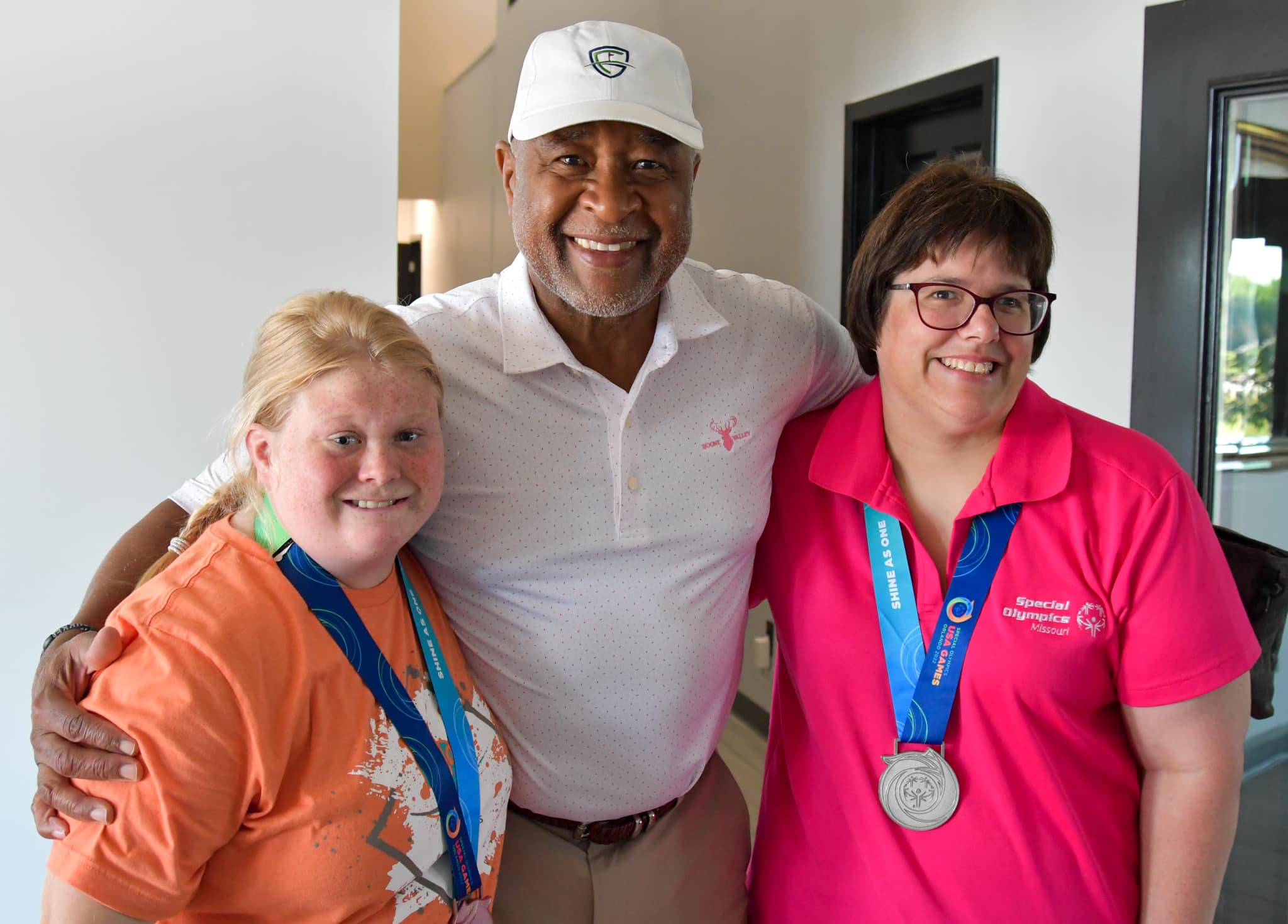 SOMO athletes Ozzie Smith and Abby Bax pose for a picture with Cardinals legend Ozzie Smith at Eagle Knoll Golf Club on Monday, July 18, 2022.