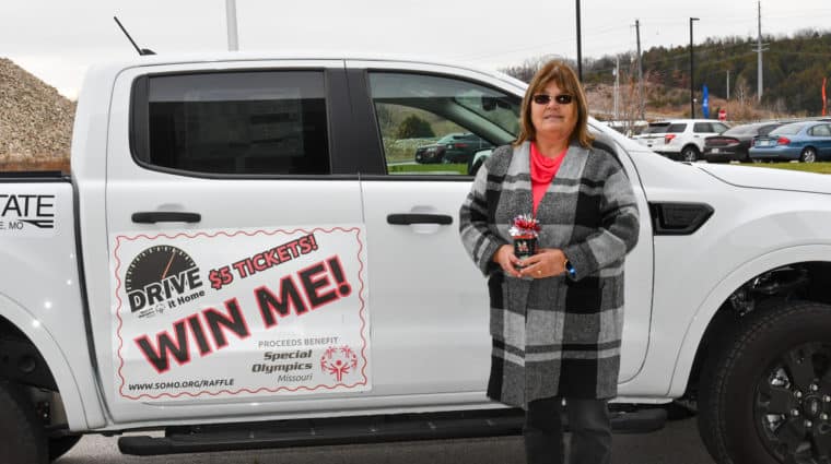 Georgia Powell, from the Southwest Area, poses for a picture next to her brand new 2022 Ford Ranger XLT 4x4. She was the winner of the 2022 Drive it Home Raffle