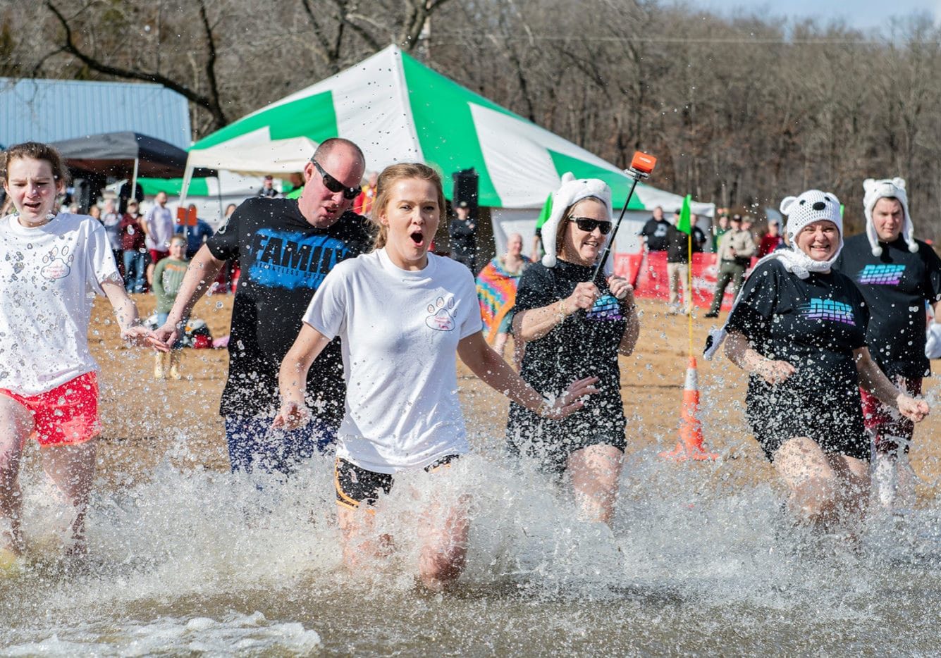 A group of Polar Plungers run into the water