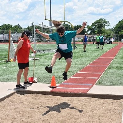 St. Joseph athlete Leah Shoemaker competes in the running long jump at the Special Olympics Missouri 2021 State Summer Games.