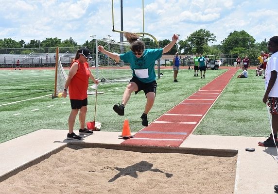 St. Joseph athlete Leah Shoemaker competes in the running long jump at the Special Olympics Missouri 2021 State Summer Games.